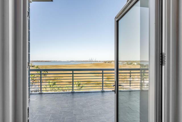 balcony featuring a water view