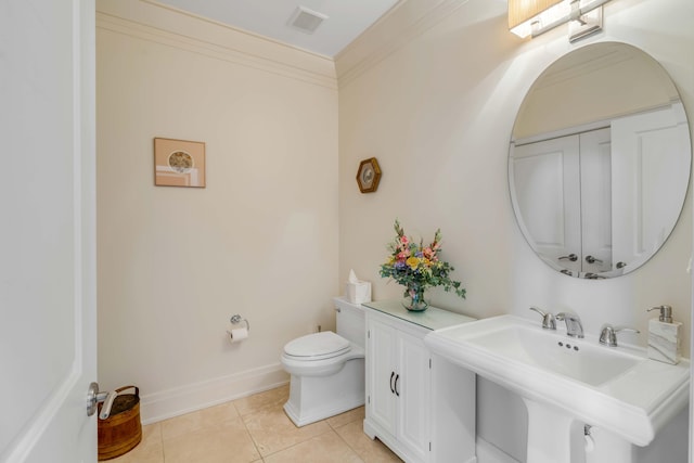 bathroom featuring sink, ornamental molding, tile patterned floors, and toilet