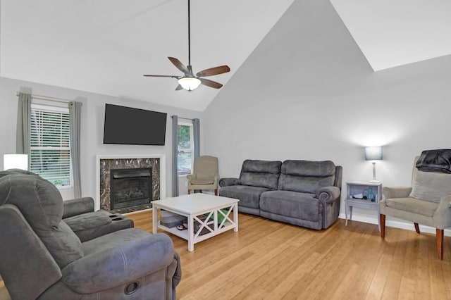 112 Fox Chase Dr, Goose Creek, SC 29445 - living room featuring light wood finished floors, a ceiling fan, a high end fireplace, and high vaulted ceiling