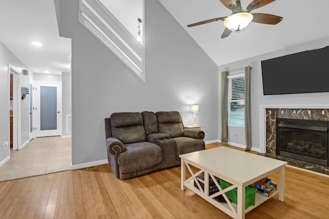112 Fox Chase Dr, Goose Creek, SC 29445 - living area featuring baseboards, ceiling fan, light wood-type flooring, a premium fireplace, and recessed lighting