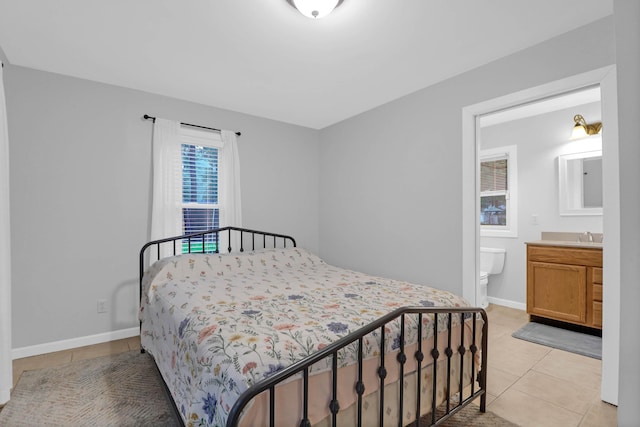 112 Fox Chase Dr, Goose Creek, SC 29445 - bedroom featuring light tile patterned floors, a sink, baseboards, and ensuite bathroom