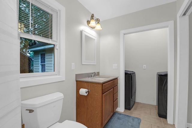 112 Fox Chase Dr, Goose Creek, SC 29445 - bathroom with washer and clothes dryer, vanity, toilet, and tile patterned flooring