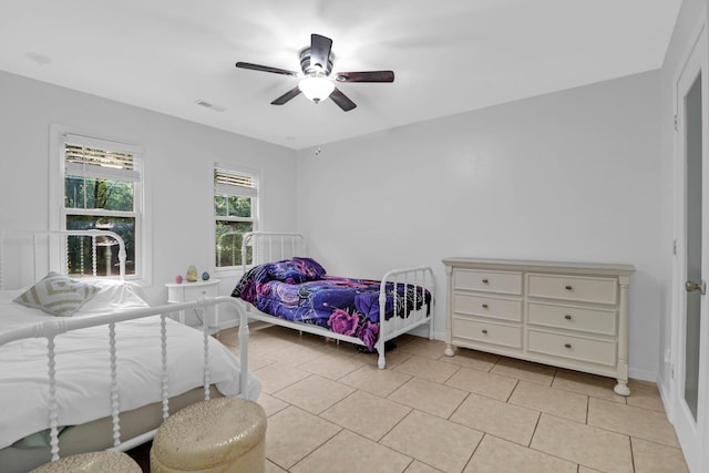 112 Fox Chase Dr, Goose Creek, SC 29445 - bedroom with light tile patterned floors, a ceiling fan, and baseboards