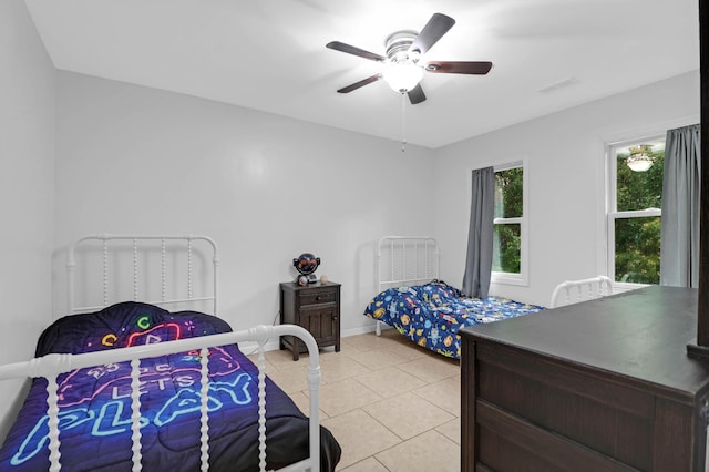 112 Fox Chase Dr, Goose Creek, SC 29445 - bedroom with light tile patterned flooring, ceiling fan, and baseboards