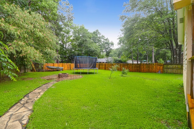 112 Fox Chase Dr, Goose Creek, SC 29445 - view of yard with a trampoline and an outdoor fire pit
