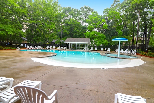 112 Fox Chase Dr, Goose Creek, SC 29445 - community pool with a patio and view of scattered trees