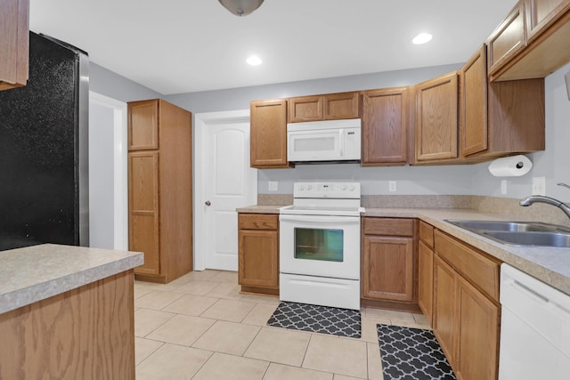 112 Fox Chase Dr, Goose Creek, SC 29445 - kitchen with white appliances, a sink, light countertops, light tile patterned flooring, and recessed lighting