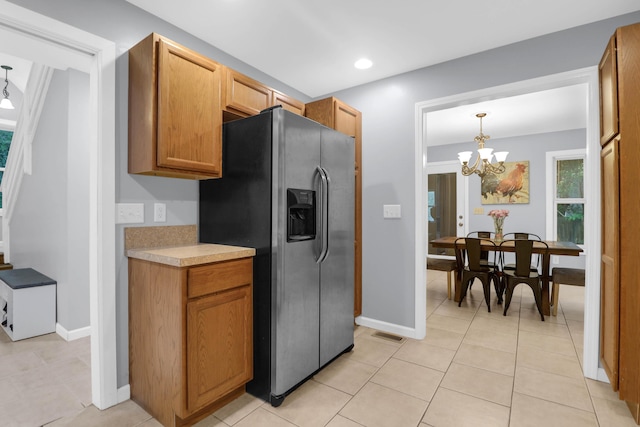112 Fox Chase Dr, Goose Creek, SC 29445 - kitchen featuring stainless steel fridge with ice dispenser, light countertops, a chandelier, baseboards, and light tile patterned floors