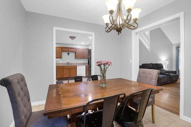 112 Fox Chase Dr, Goose Creek, SC 29445 - dining room with a chandelier, light tile patterned floors, and baseboards