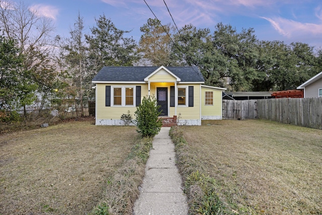 bungalow-style home featuring a lawn