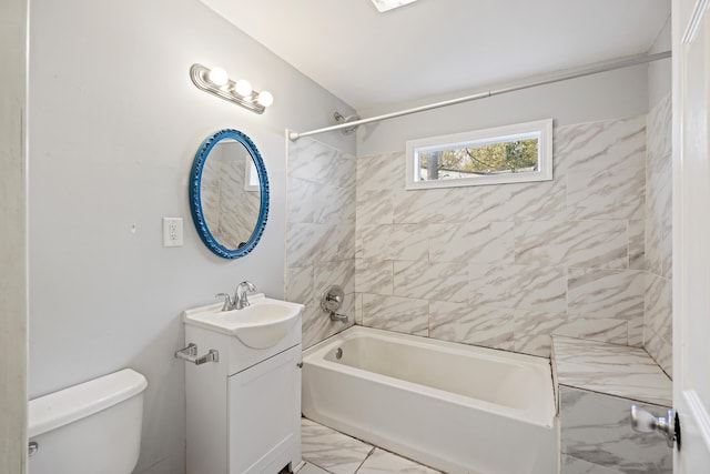 full bathroom with vanity, toilet, and tiled shower / bath