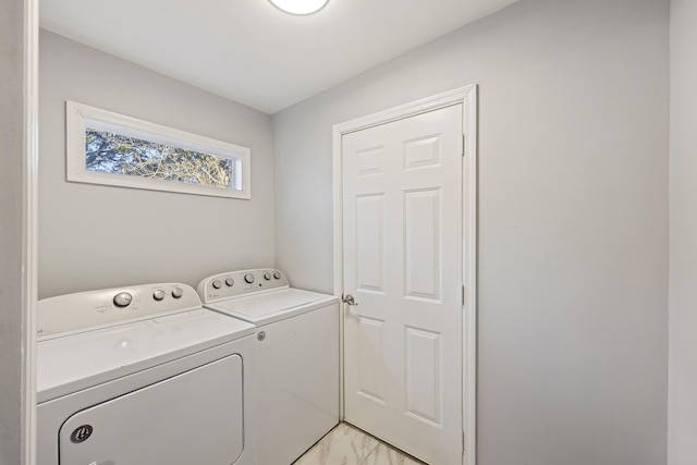 laundry room with washing machine and dryer