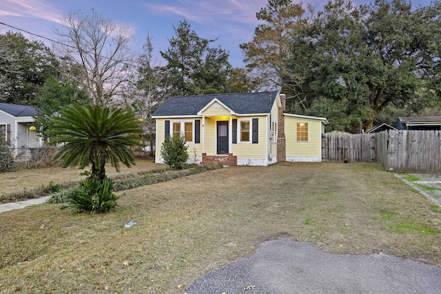 view of front of house with a yard