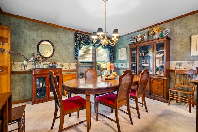 carpeted dining area with an inviting chandelier and ornamental molding