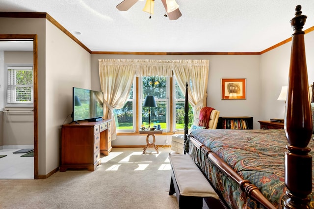 bedroom with ceiling fan, light colored carpet, crown molding, and a textured ceiling