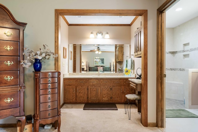 bathroom featuring walk in shower, crown molding, vanity, and ceiling fan