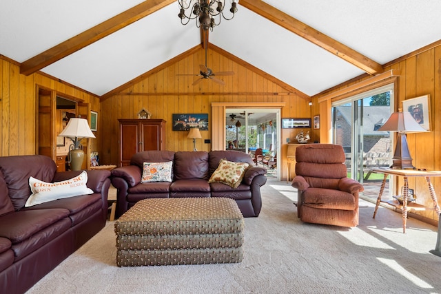 carpeted living room with beamed ceiling, wooden walls, and a healthy amount of sunlight