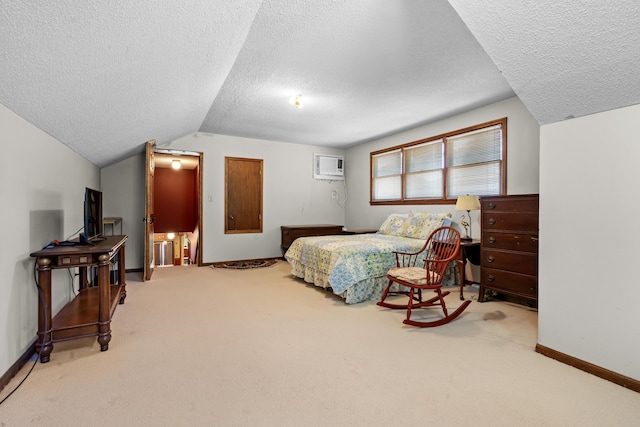 bedroom with a textured ceiling, lofted ceiling, carpet, and a wall mounted AC