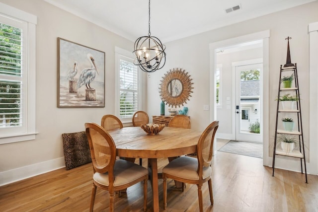 1903 Bolden Dr, Mount Pleasant, SC 29466 - dining room with light wood finished floors and a chandelier