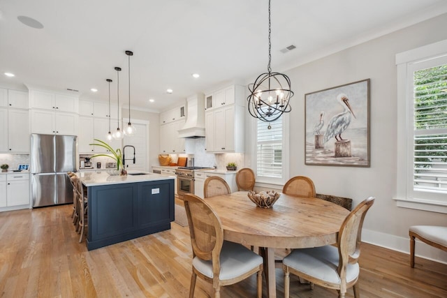 1903 Bolden Dr, Mount Pleasant, SC 29466 - dining room featuring a chandelier, light wood-type flooring, recessed lighting, and crown molding