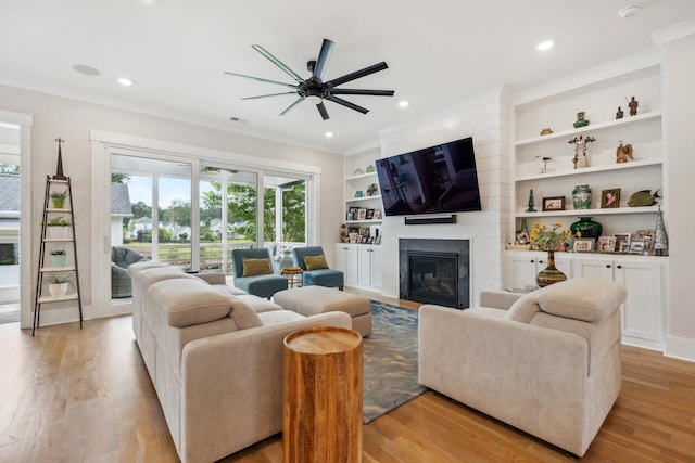 1903 Bolden Dr, Mount Pleasant, SC 29466 - living room featuring a ceiling fan, plenty of natural light, a fireplace, light wood finished floors, and recessed lighting