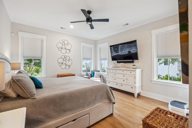 1903 Bolden Dr, Mount Pleasant, SC 29466 - bedroom featuring multiple windows, light wood-style flooring, and ceiling fan