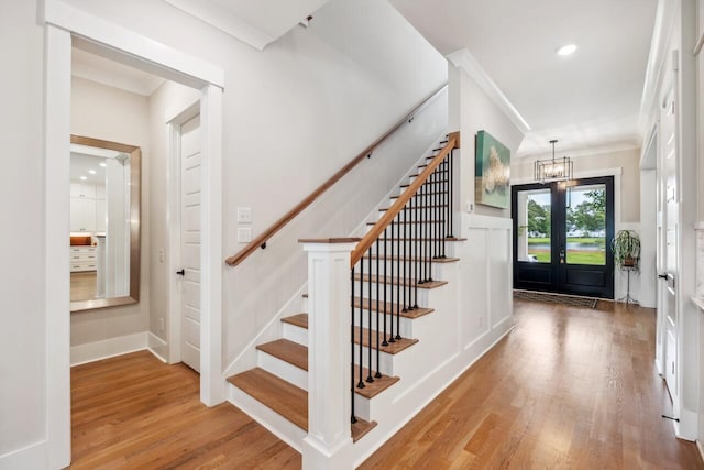 1903 Bolden Dr, Mount Pleasant, SC 29466 - foyer entrance with stairway, a chandelier, wood finished floors, crown molding, and recessed lighting