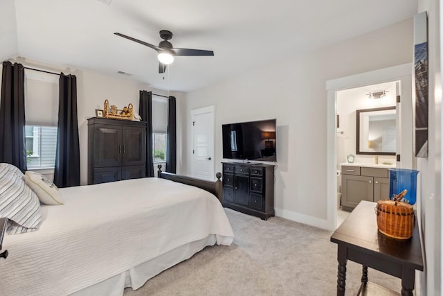 1903 Bolden Dr, Mount Pleasant, SC 29466 - bedroom with light carpet, multiple windows, ensuite bathroom, and a ceiling fan