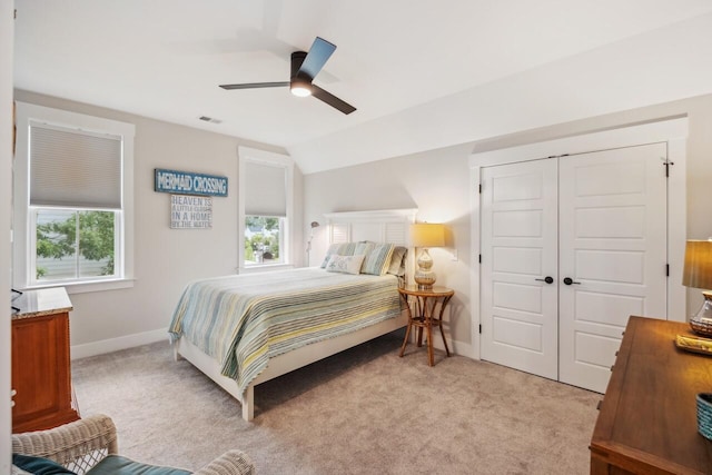 1903 Bolden Dr, Mount Pleasant, SC 29466 - bedroom with multiple windows, light carpet, vaulted ceiling, a closet, and a ceiling fan