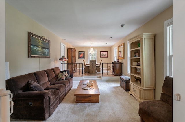 living area with light colored carpet