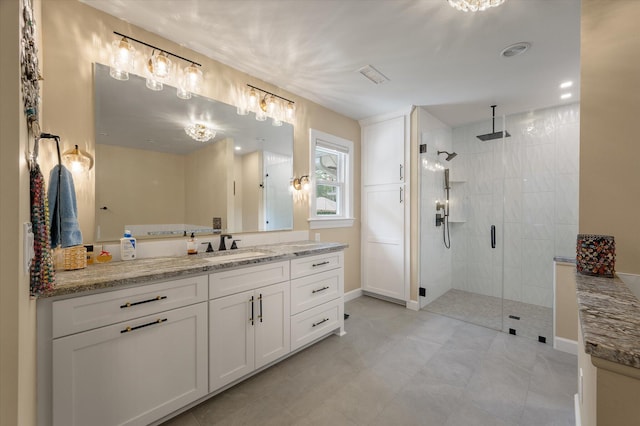 bathroom featuring a stall shower and vanity