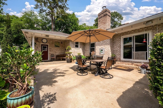 view of patio / terrace featuring entry steps and outdoor dining area