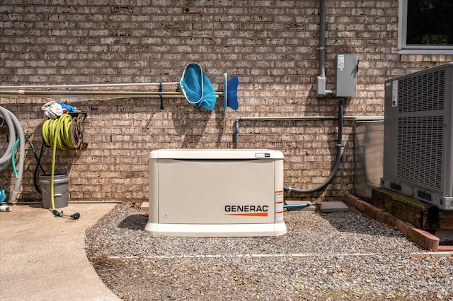 exterior view of a power unit, central AC, and brick siding