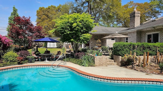 outdoor pool featuring a patio area
