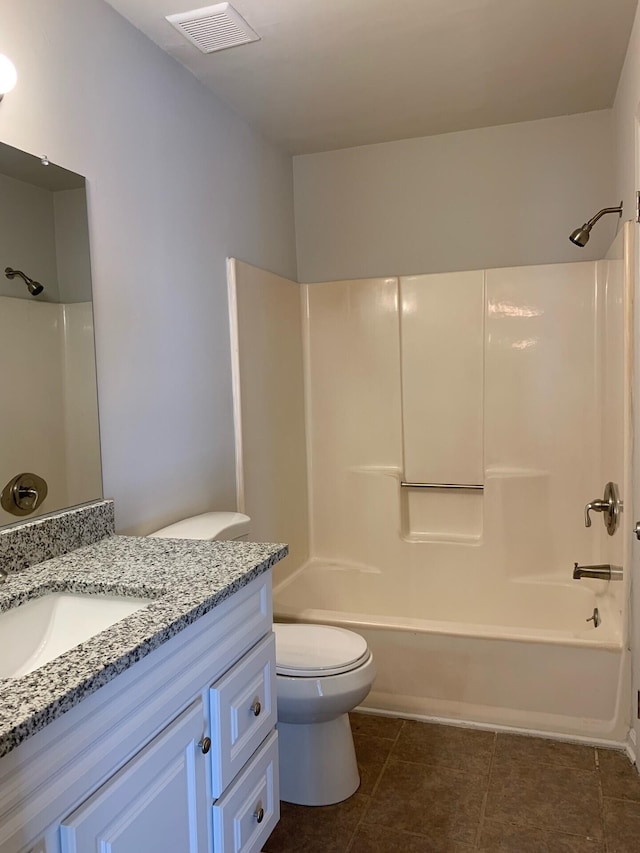 bathroom featuring visible vents, toilet, vanity, tile patterned flooring, and shower / bathtub combination