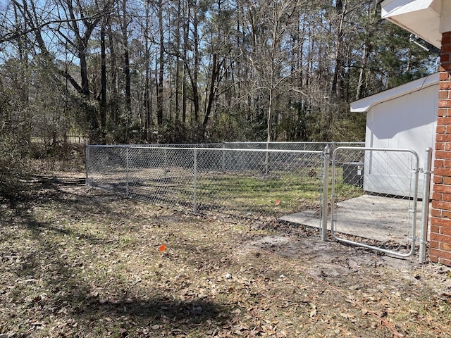 view of yard with a gate and fence