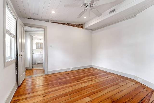 empty room with light hardwood / wood-style floors and ceiling fan