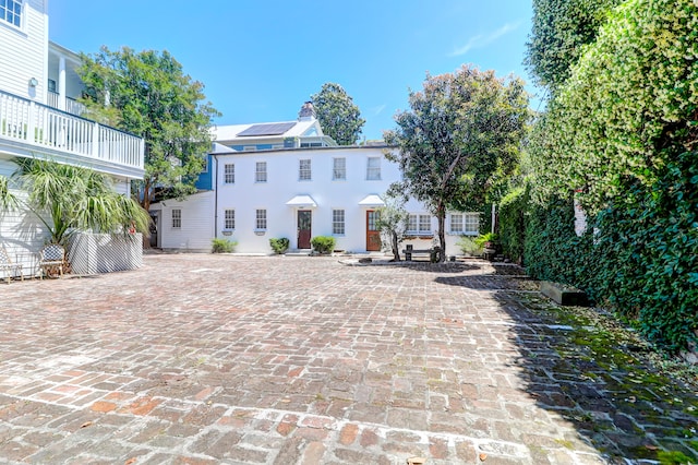 colonial house featuring a patio