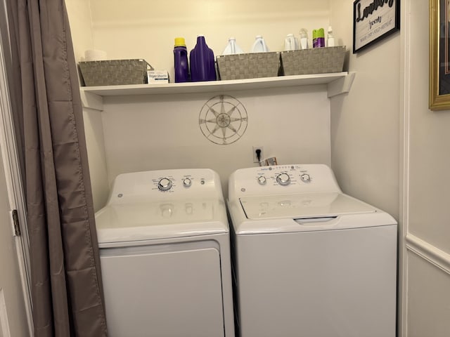 laundry area featuring laundry area and washer and clothes dryer