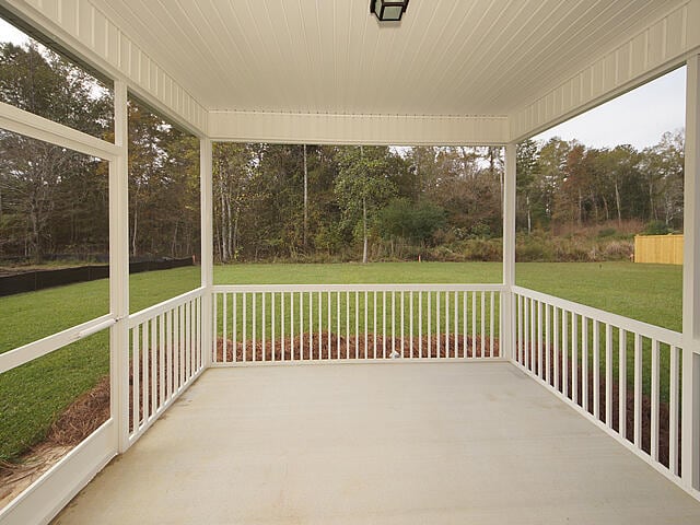 unfurnished sunroom featuring wood ceiling