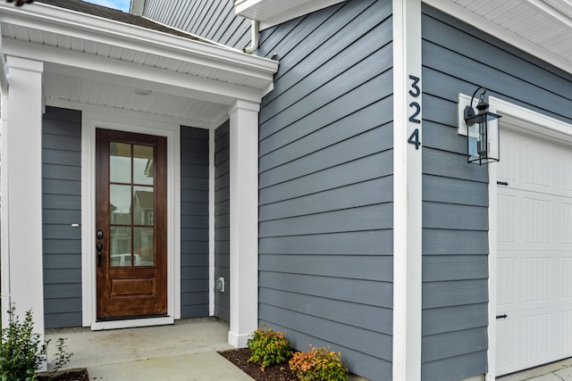 entrance to property featuring a garage