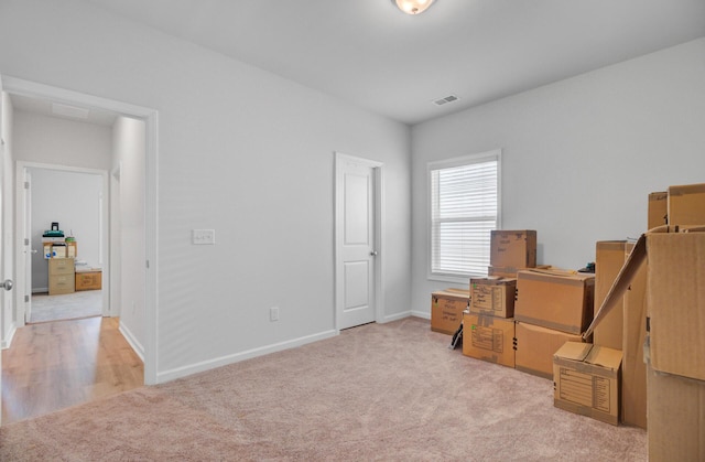 carpeted bedroom with baseboards