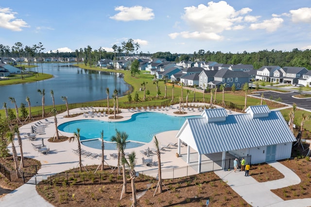 view of pool with a water view