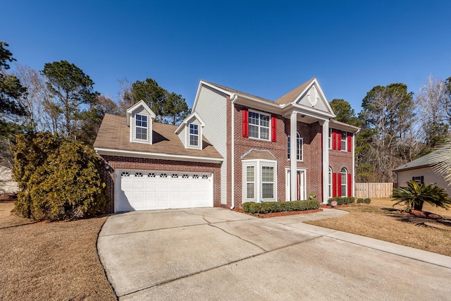 view of front of house featuring a garage and a front yard