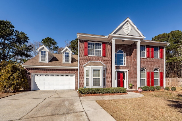 view of front of property with a garage and a front yard