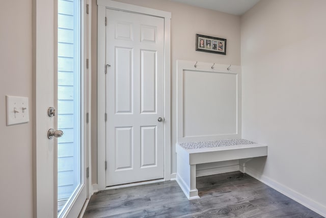 mudroom featuring baseboards and wood finished floors