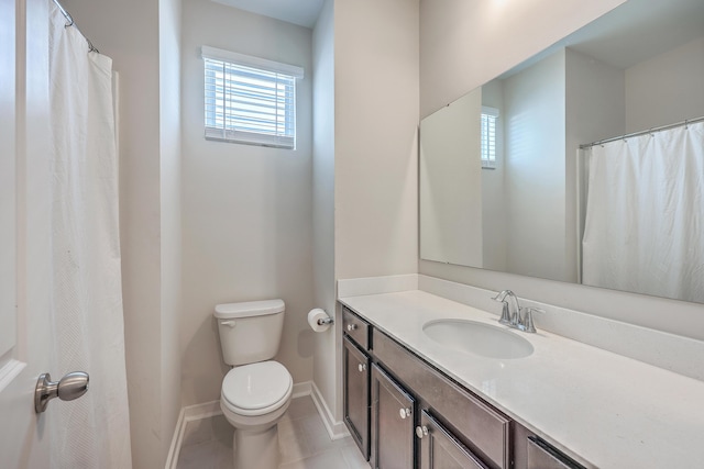 full bathroom with baseboards, vanity, toilet, and tile patterned floors