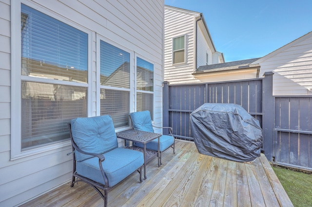 wooden terrace featuring area for grilling