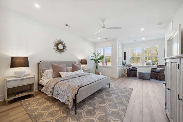 bedroom with ceiling fan and wood-type flooring