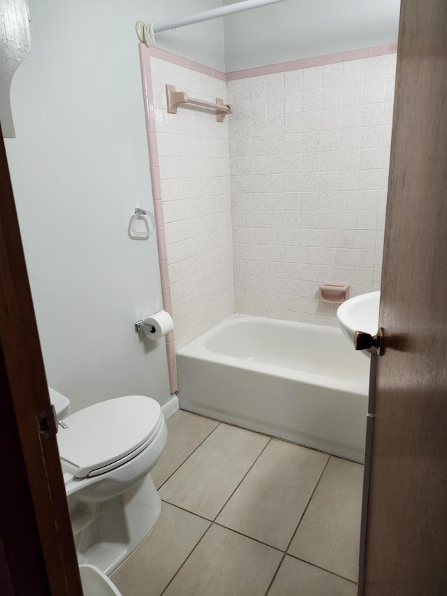 4029 Karen Dr, North Charleston, SC 29405 - full bath with tile patterned floors, toilet, and washtub / shower combination